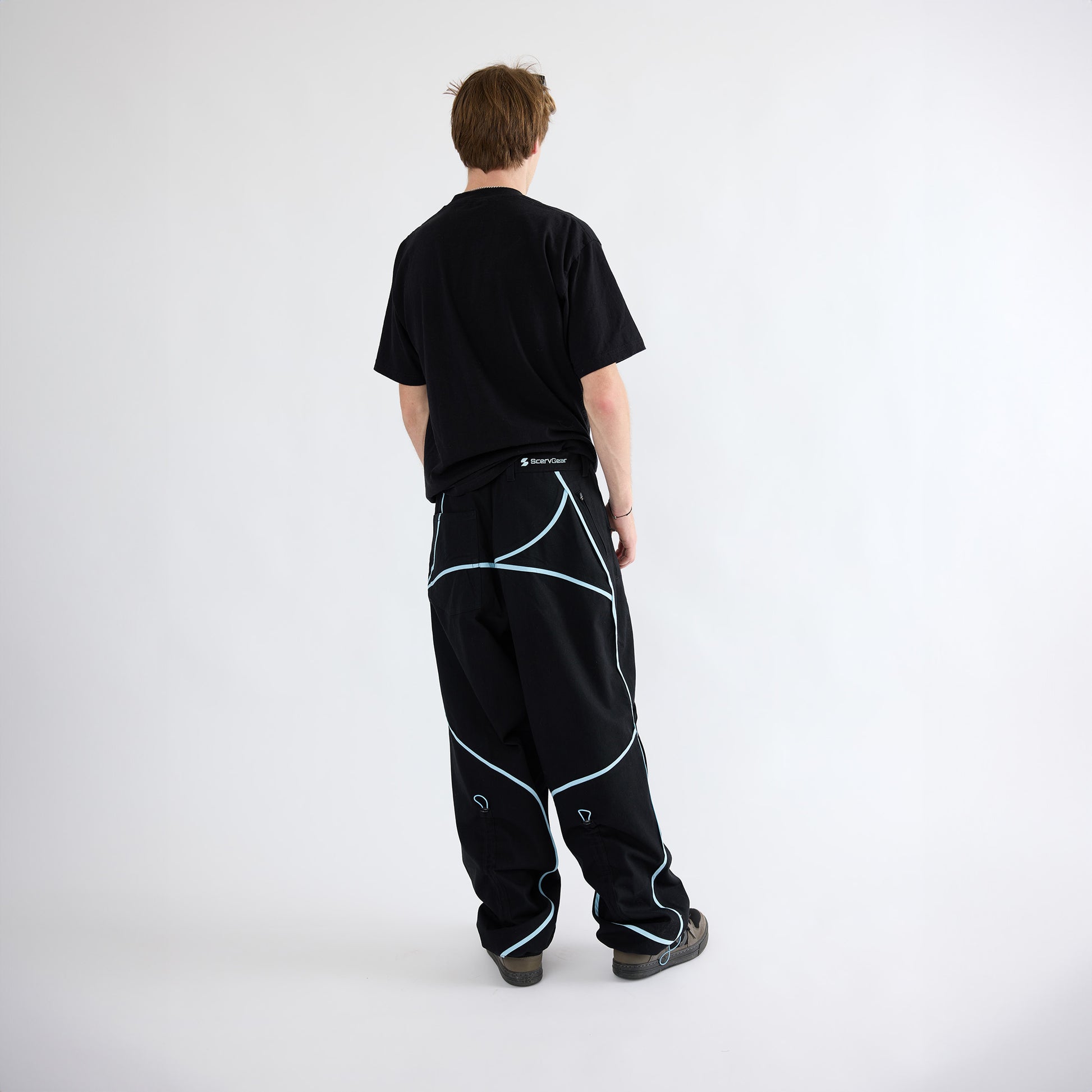 Back view of black baggy pants on model