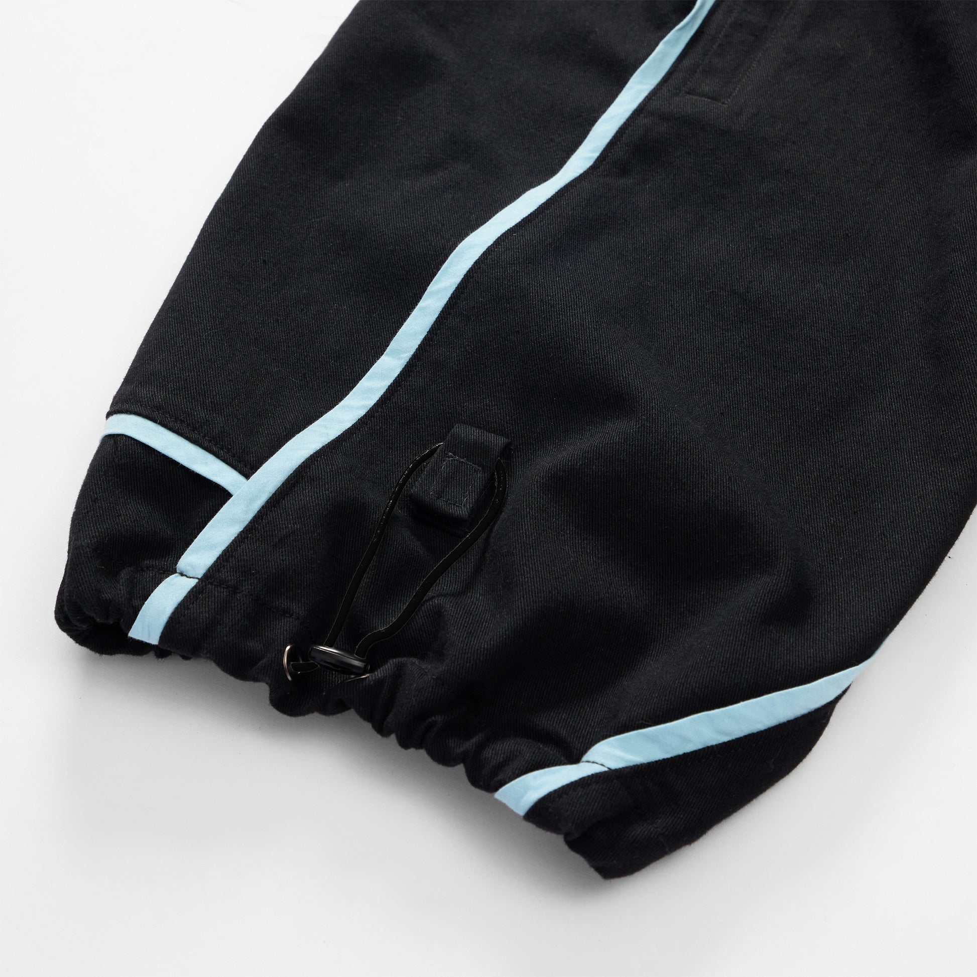 Close up on Velcro tab to hold cuff drawstring