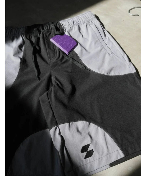 Picture of Scerfer Boardshorts with a surfboard wax comb.