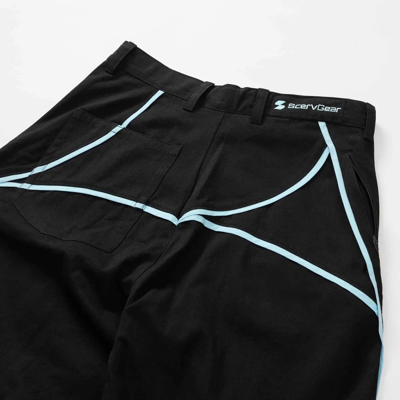 Close-up of waistband and back seam detailing on black Curvy Baggy Pants featuring built-in belt system and engineered curved lines.